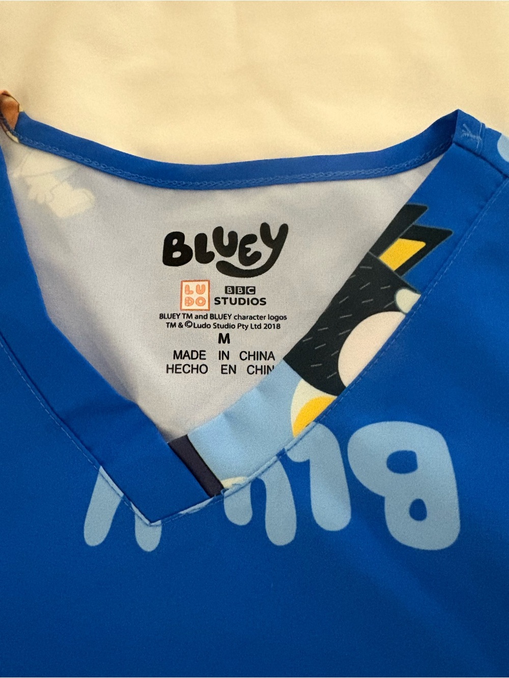 Bluey BBC Studios scrubs top Cartoon Puppy Graphic Top for Women m